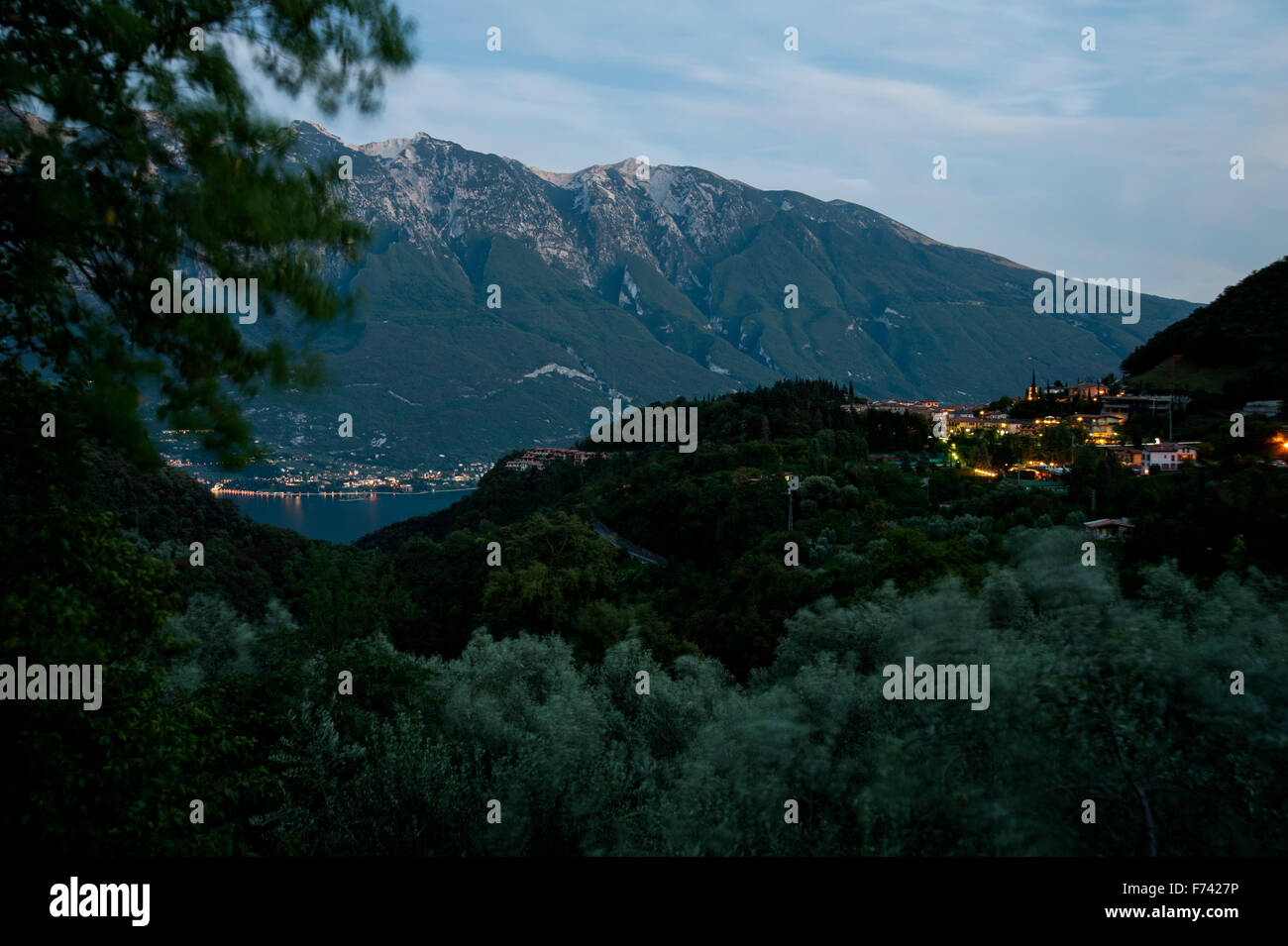 Night over Lago di Garda, View from Tremosine with Village Pieve and Monte Baldo- Italy Stock Photo