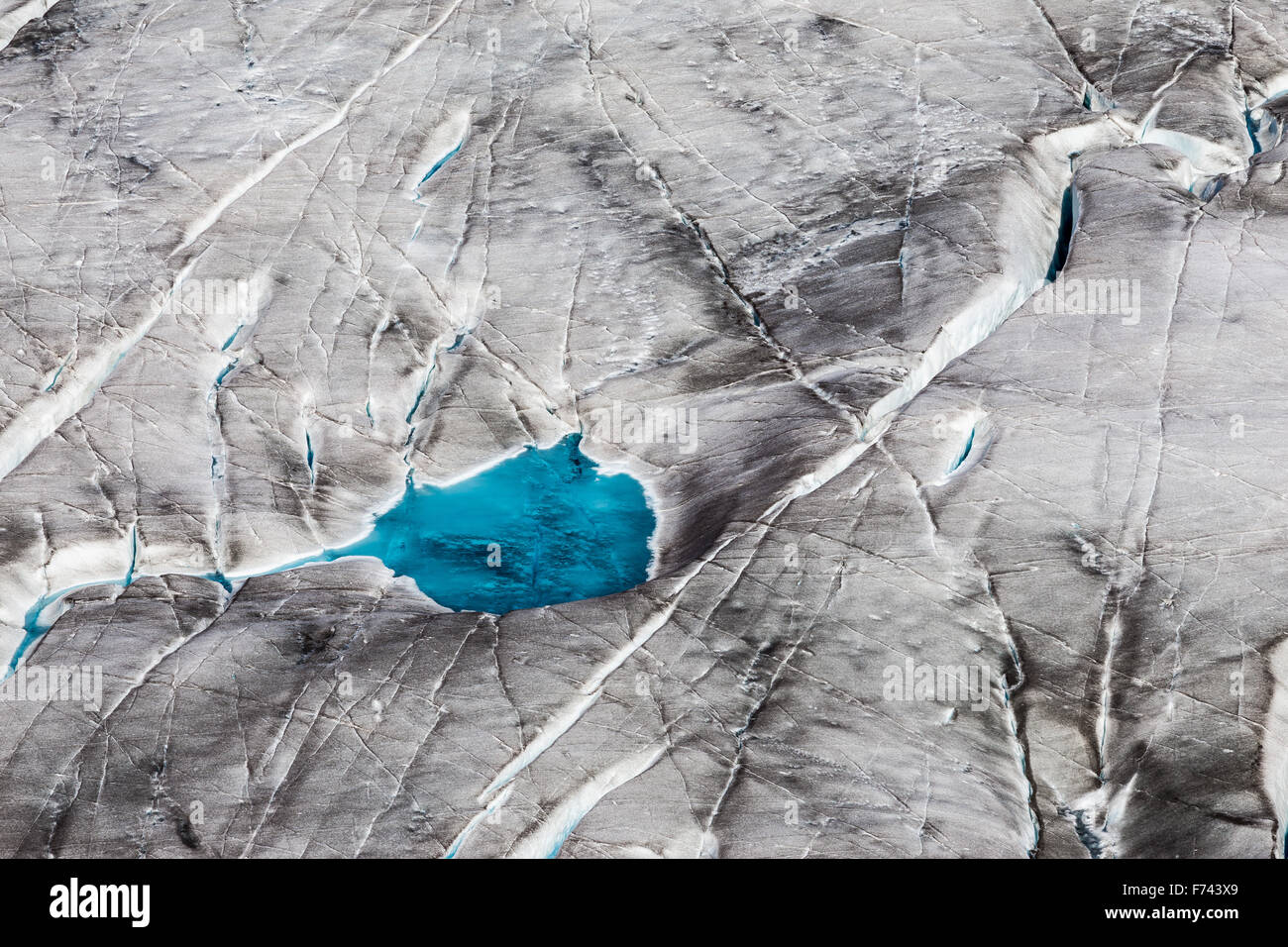 The Aletsch Glacier. Aletschgletscher. Blue water of glacial surface lake. Eastern Bernese Alps in the Swiss canton of Valais. Switzerland. Stock Photo