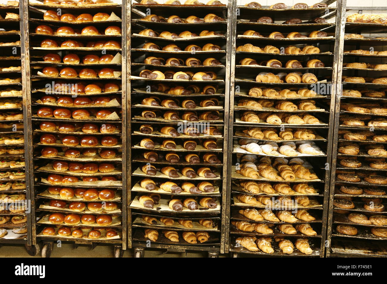 Freshly baked bread in a bakery on stacked trays Stock Photo Alamy