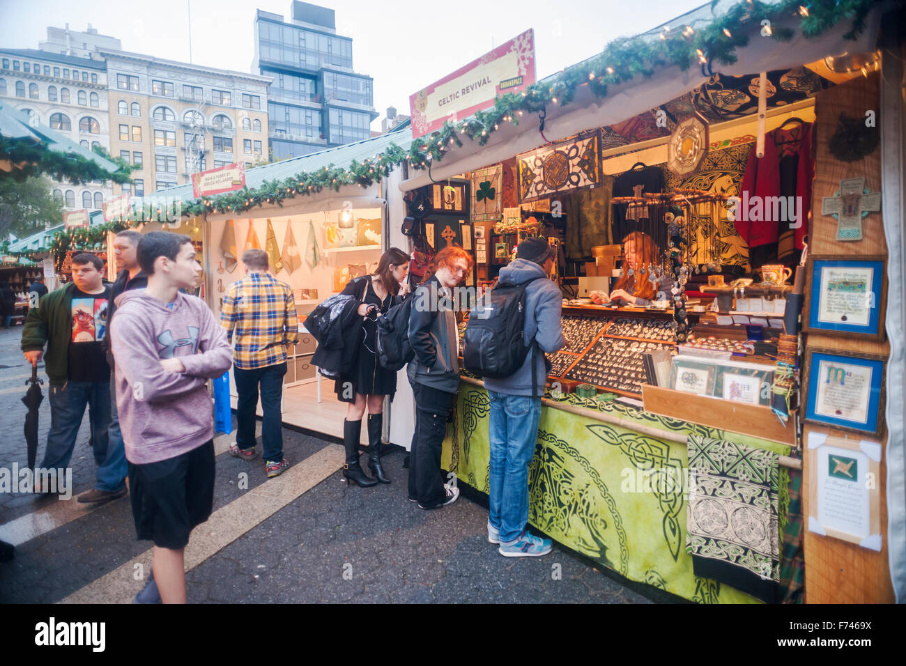 Shoppers browse the Union Square Holiday Market in New York on a rainy opening day, Thursday, November 19, 2015. 150 vendors, including a 'Made in Brooklyn' section, sell their holiday wares at the market, now in it's 22nd year. The market will remain open daily, closing on December 24.  (© Richard B. Levine) Stock Photo