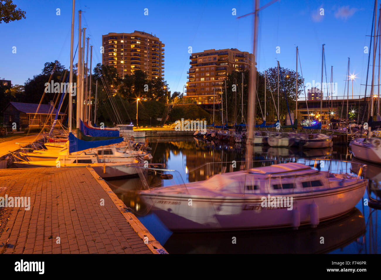 Sailboats at the Oakville Harbour at dusk. Shipyard Park, Oakville, Ontario, Canada. Stock Photo