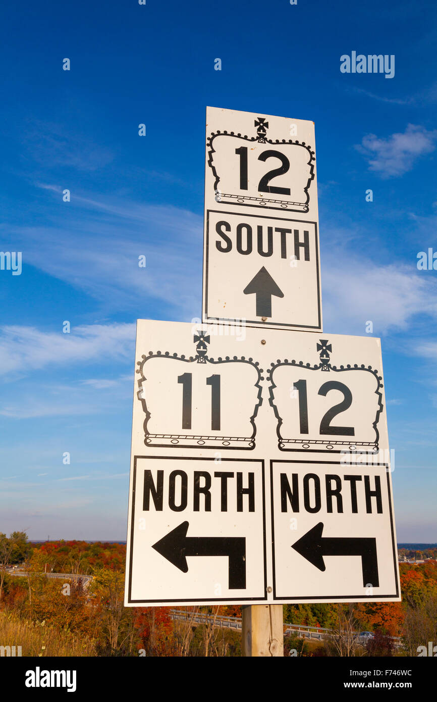 Road signs poiting to Highway 12 and Highway 11. Orillia, Ontario, Canada. Stock Photo
