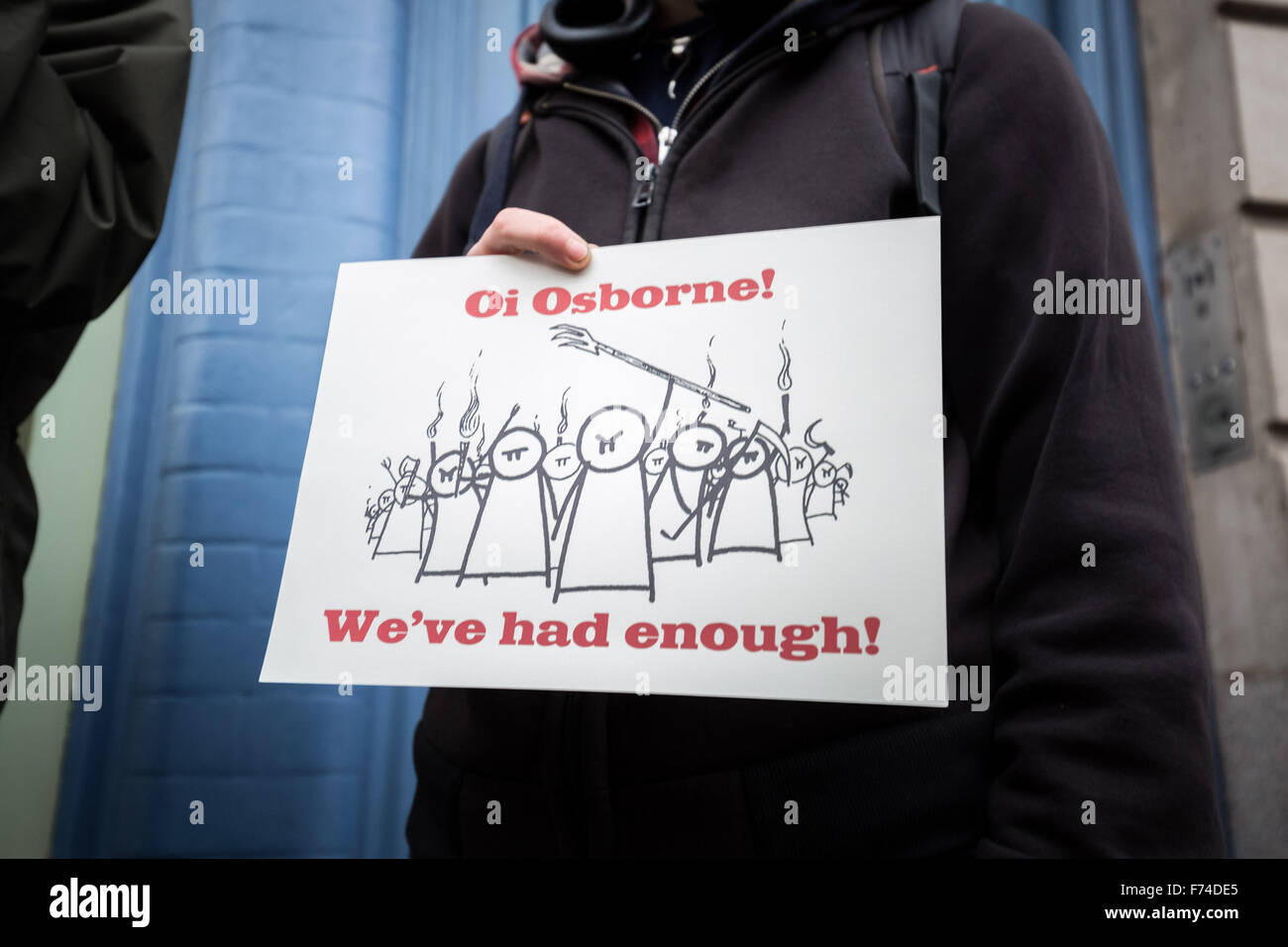 London, UK. 25th November, 2015. Protesters from anti-capitalist group ‘Class War’ protested outside a shop ‘Osborne & Little’ situated on the King's Road belonging to Chancellor of the Exchequer George Osborne's family. Osborne & Little is an upmarket fabric and wallpapers company which was co-founded by the Chancellor of the Exchequer's father Sir Peter Osborne, 17th Baronet of Ballintaylor and Ballylemon. The protest was organised to coincide with George Osborne's Autumn Statement in the House of Commons Credit:  Guy Corbishley/Alamy Live News Stock Photo