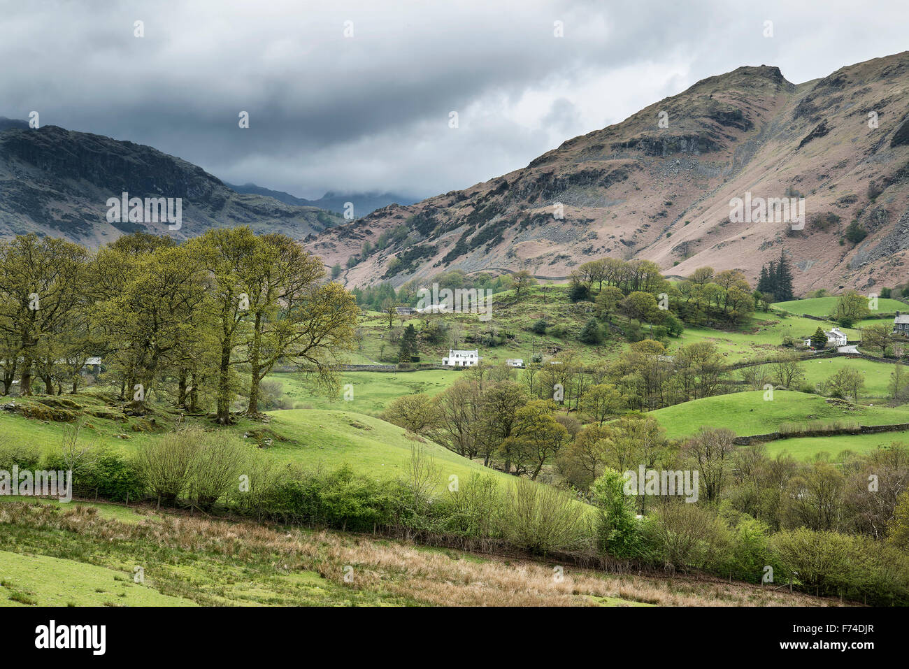 Beautiful old village landscape nestled amongst hills in Lake District Stock Photo