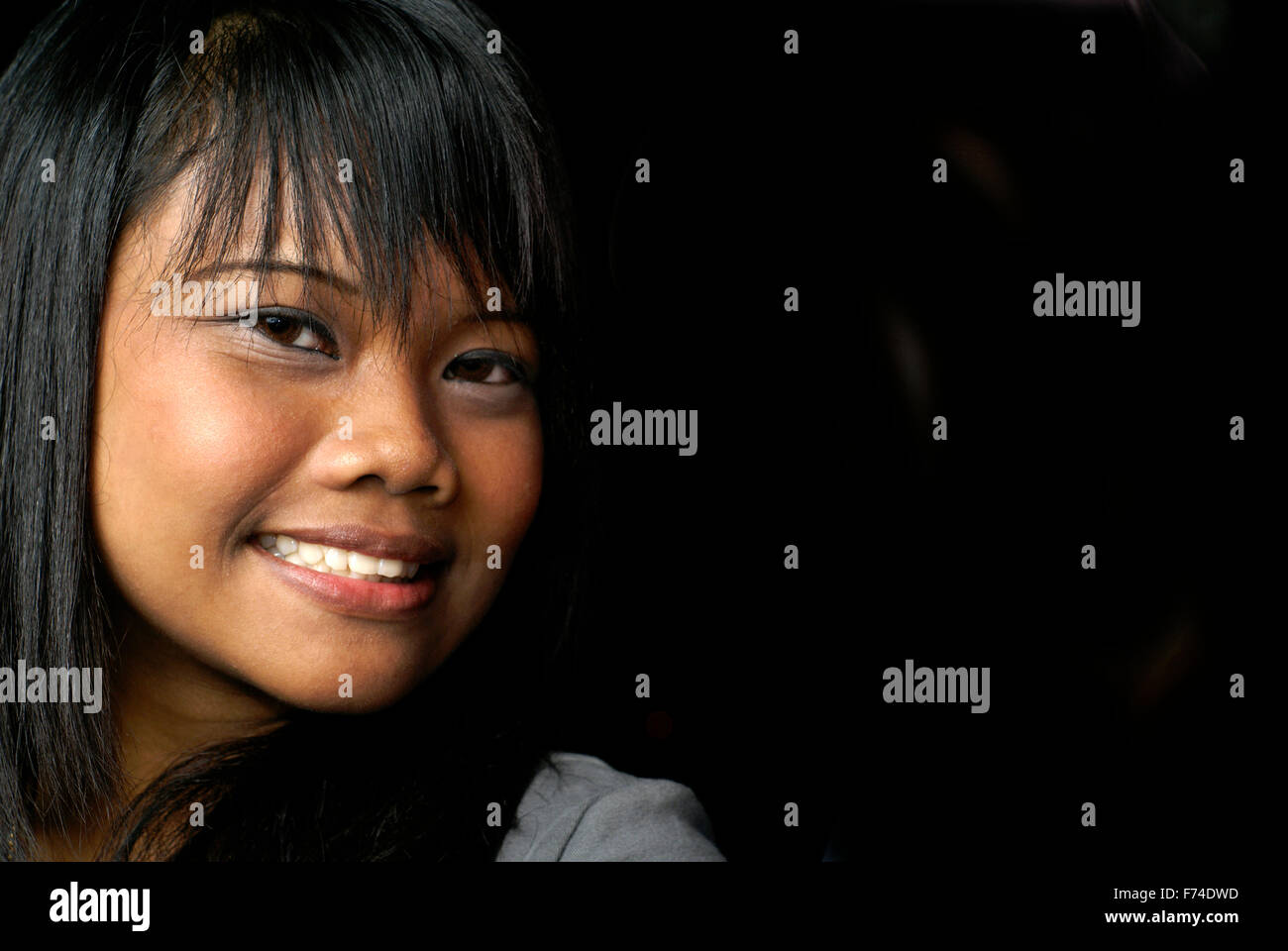 Smiling asian lady Stock Photo - Alamy