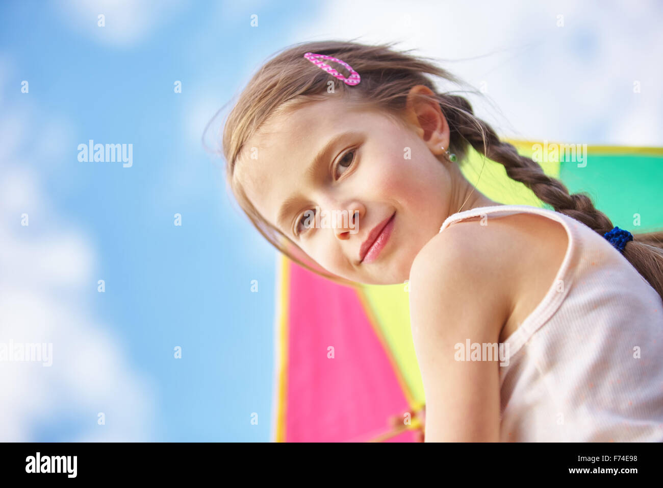 Portrait of a young girl with a kite in summer Stock Photo