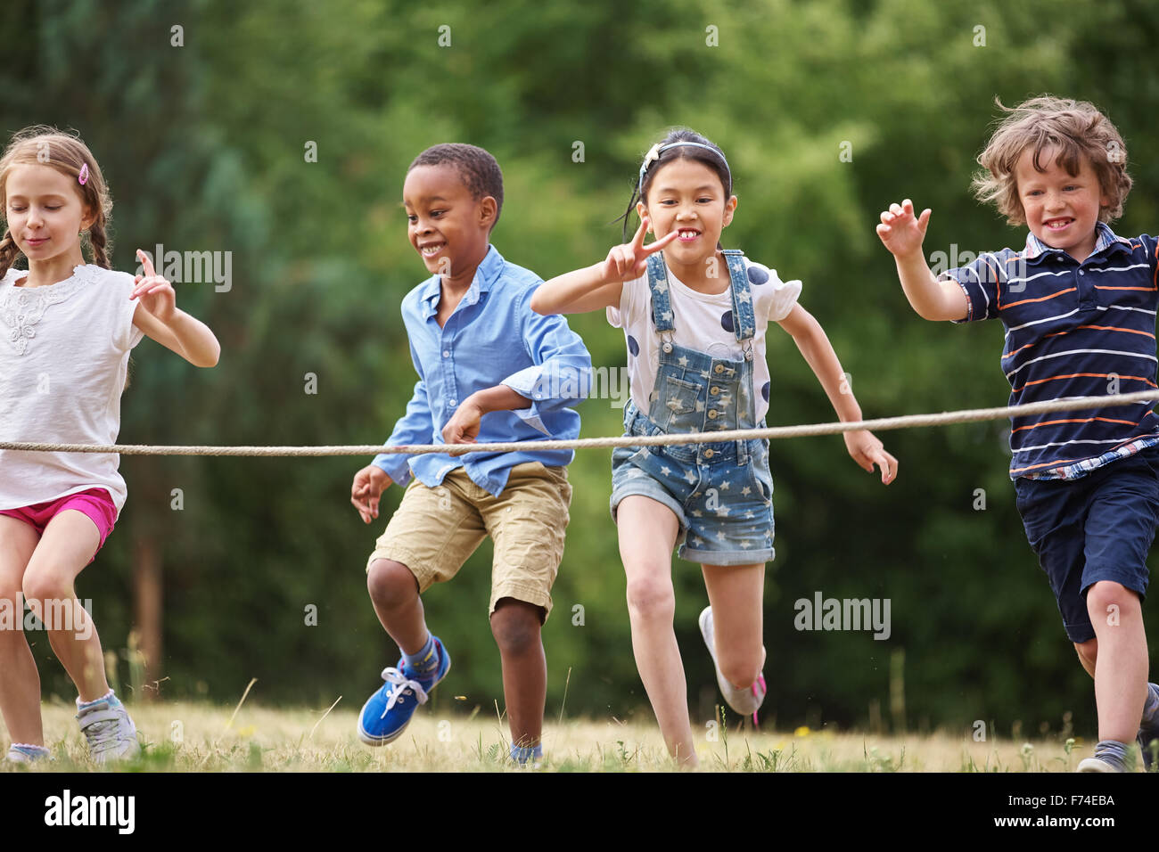 Interracial group of kids at the finish line Stock Photo