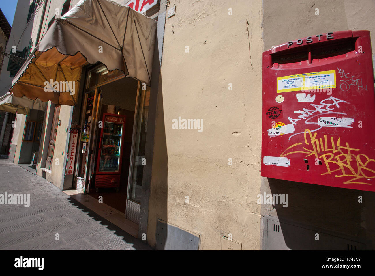 Red letter box post office red coca cola fridge Florence street scene Stock Photo