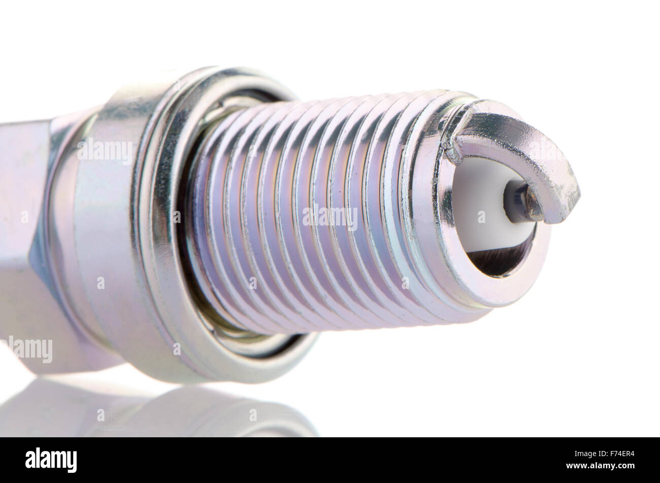 Spark-plug on white reflective background Stock Photo - Alamy