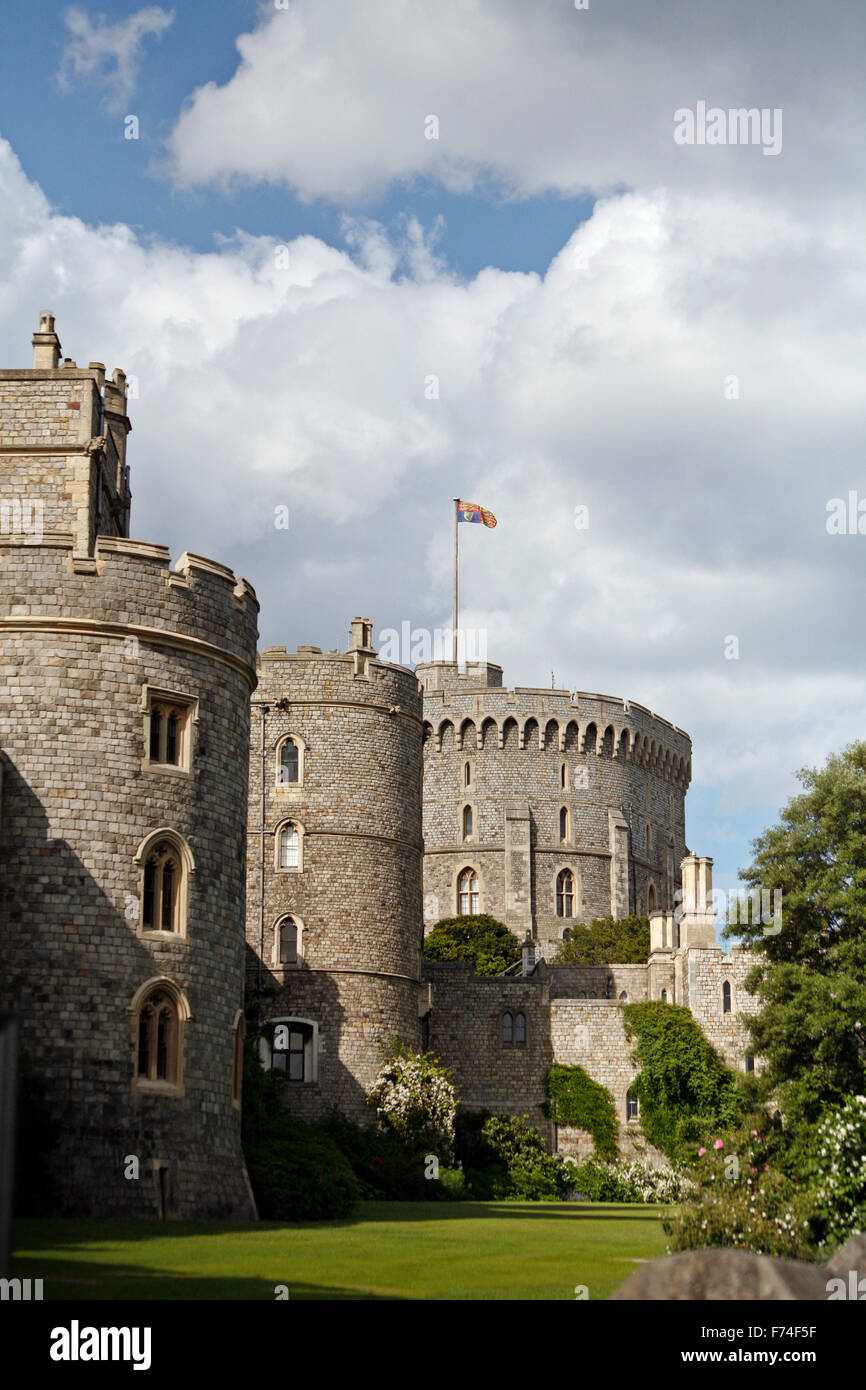 Windsor castle with royal standard flag flying at top of mast denoting queen in residence Stock Photo