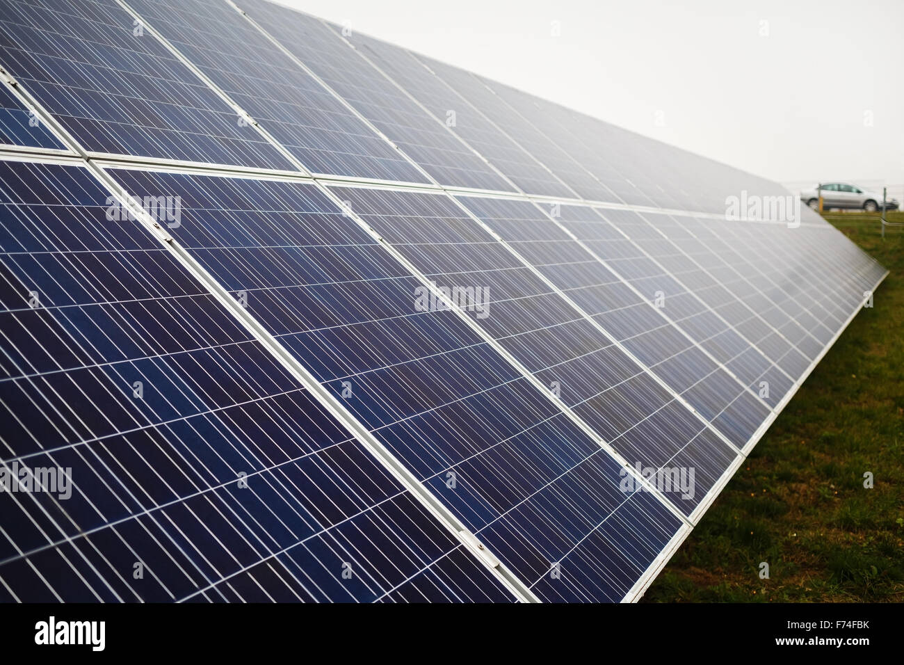 Solar panel on a cloudy day. Photovoltaic solar farm. Shallow depth of