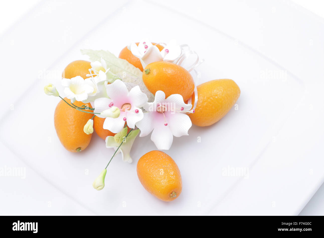 Kumquats and flower Stock Photo Alamy