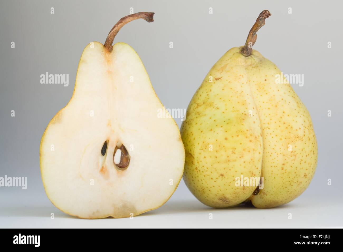 Open and closed pear Stock Photo - Alamy