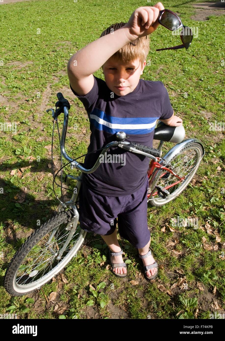 Boy with bicycle Stock Photo Alamy