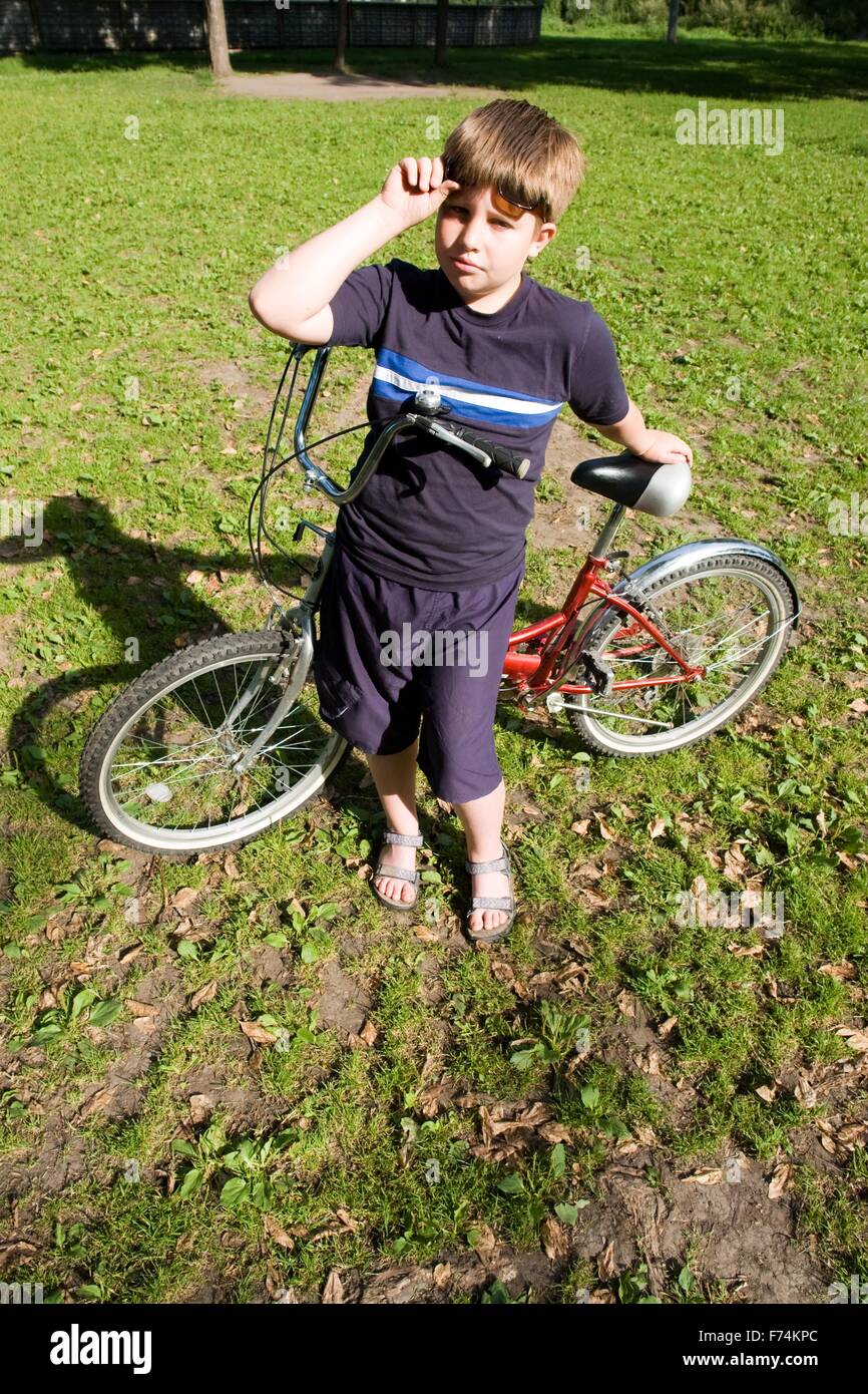 Boy with bicycle Stock Photo Alamy