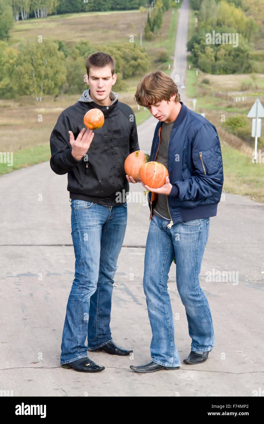 dudes with pumpkins Stock Photo