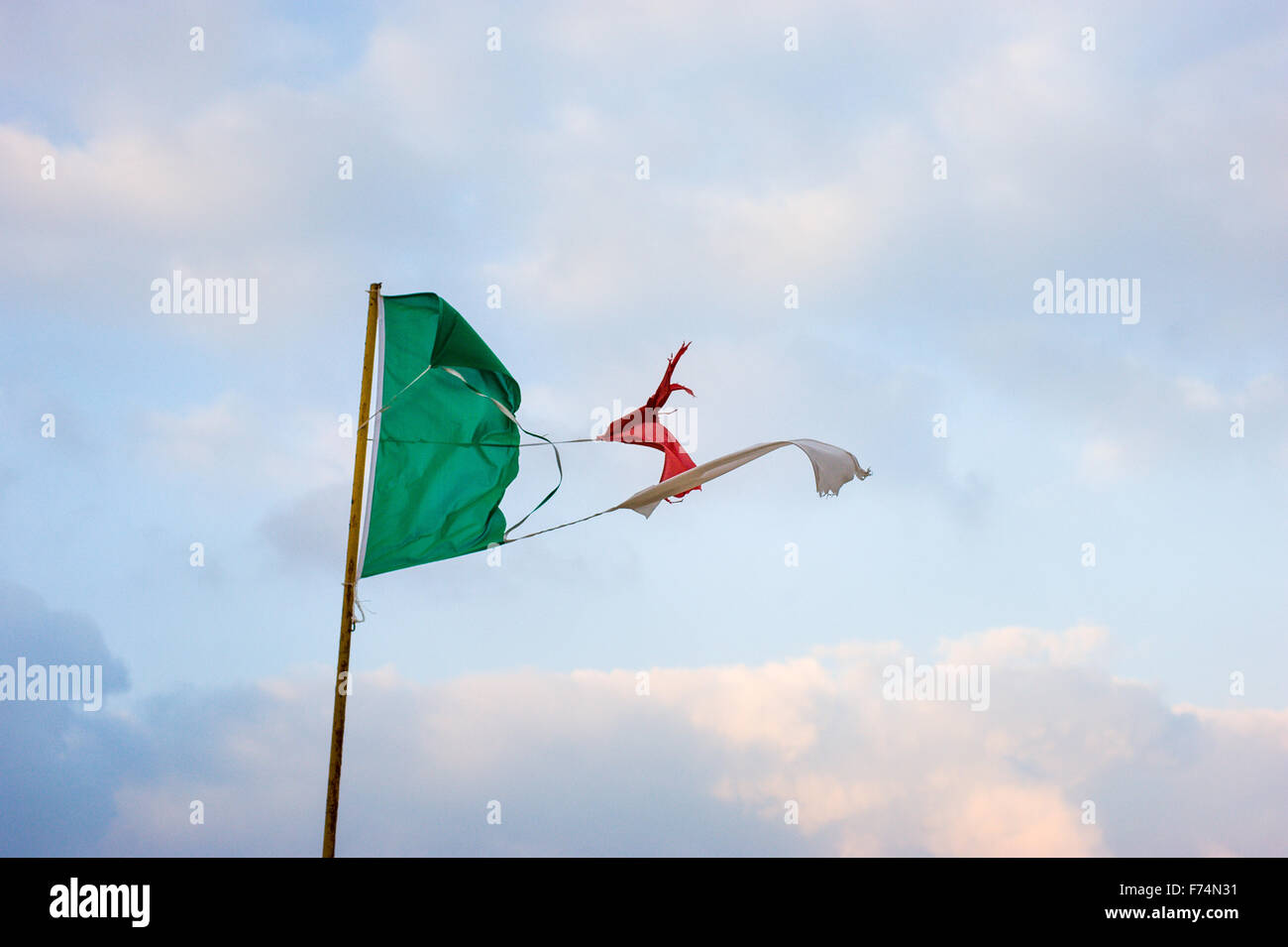Torn and tattered Italian flag Stock Photo