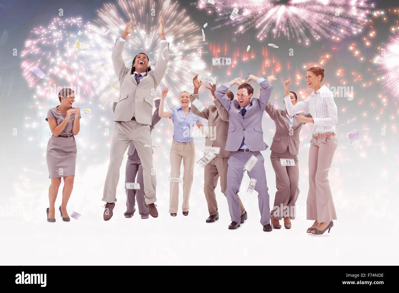 Composite image of very happy people with money falling from the sky Stock Photo