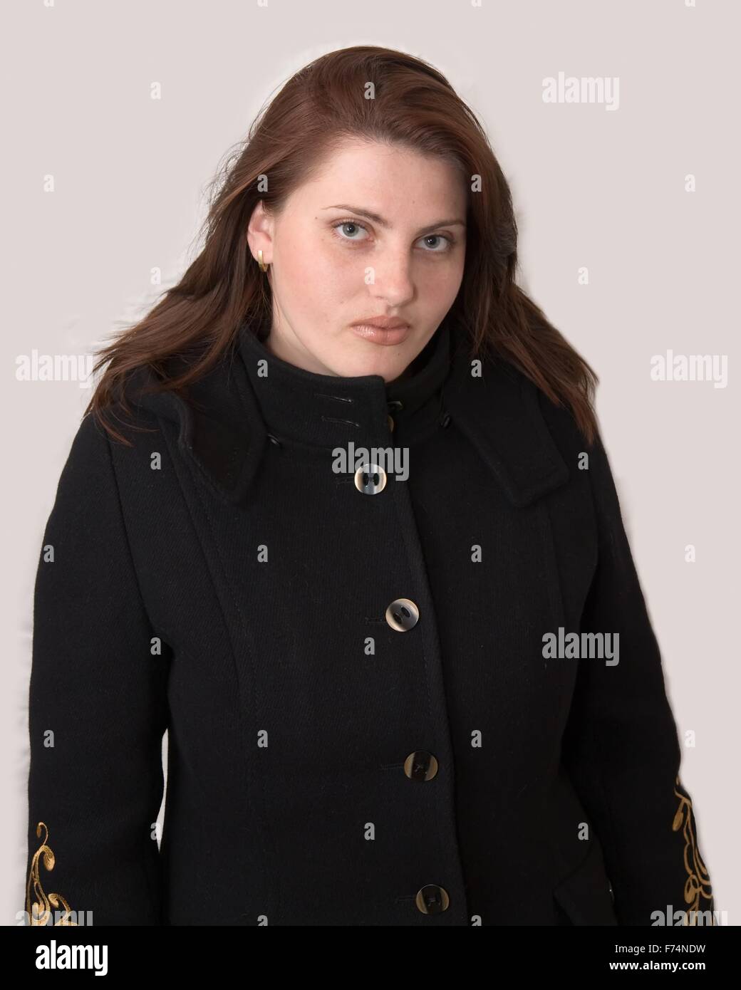 Person in black coat hi-res stock photography and images - Alamy