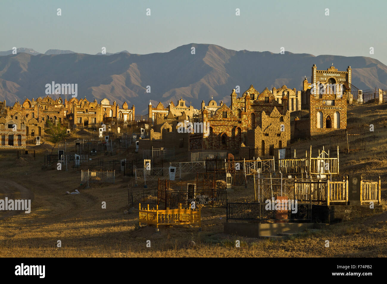 Muslim cemetery in along the M41 in north western Kyrgyzstan. - Stock Image