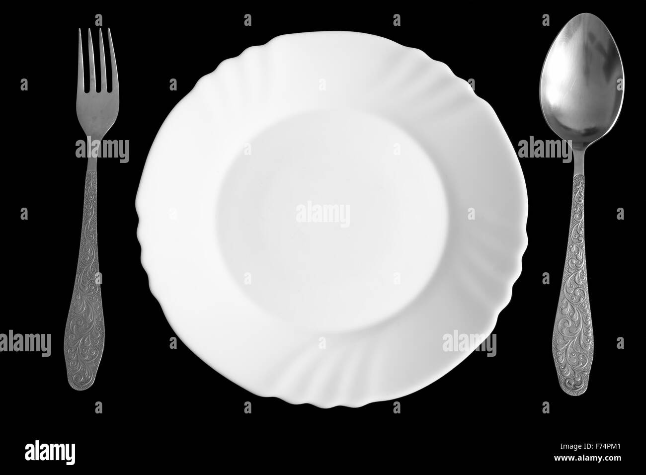Plate, spoon and fork Stock Photo