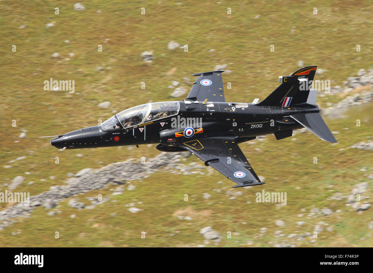 RAF Hawk T2 jet training aircraft on a low level flying exercise in Wales, UK. Stock Photo