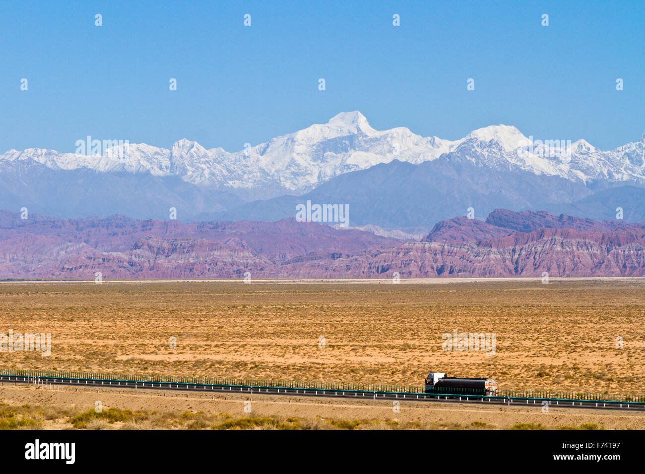 The spectacular Tien Shan mountain ranges in Xinjiang autonomous region in China. The highest peak on this image - Stock Image