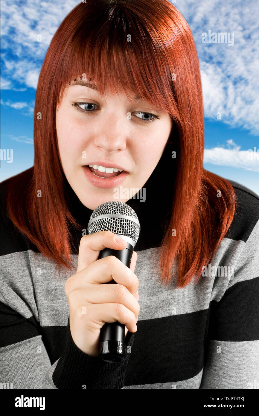 Girl singing karaoke Stock Photo Alamy