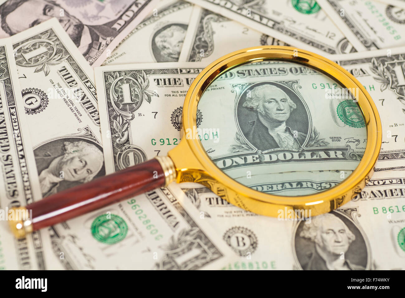 dollar banknotes under magnifying glass,closeup Stock Photo