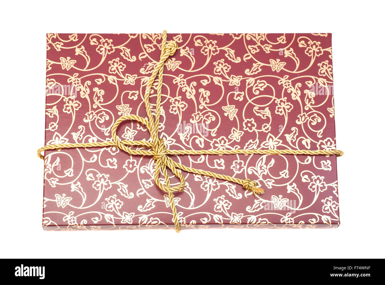 Gift box with golden rope isolated on white Stock Photo - Alamy