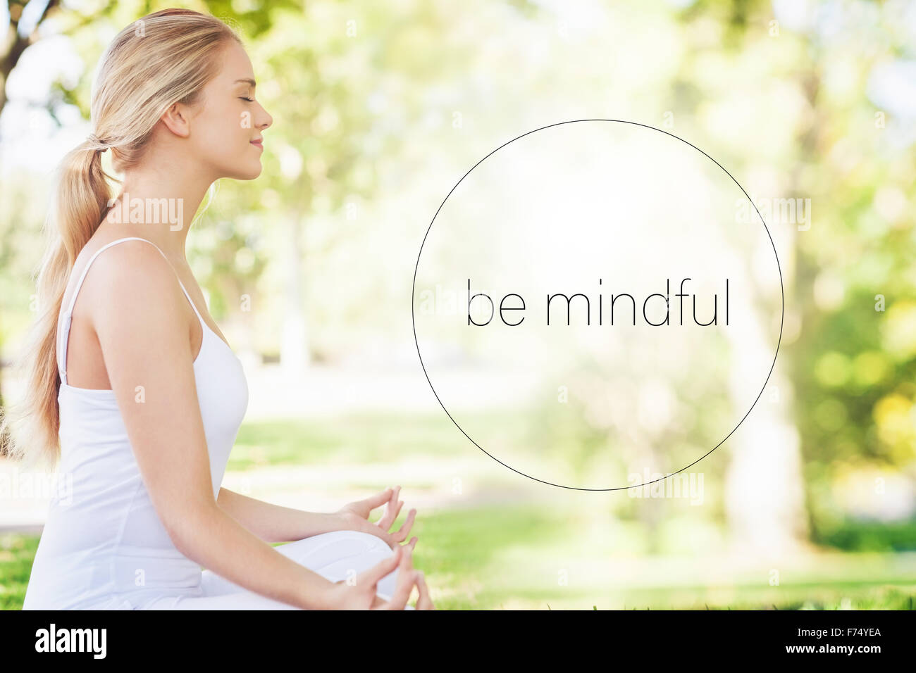 Composite image of mid section of calm young woman meditating Stock Photo