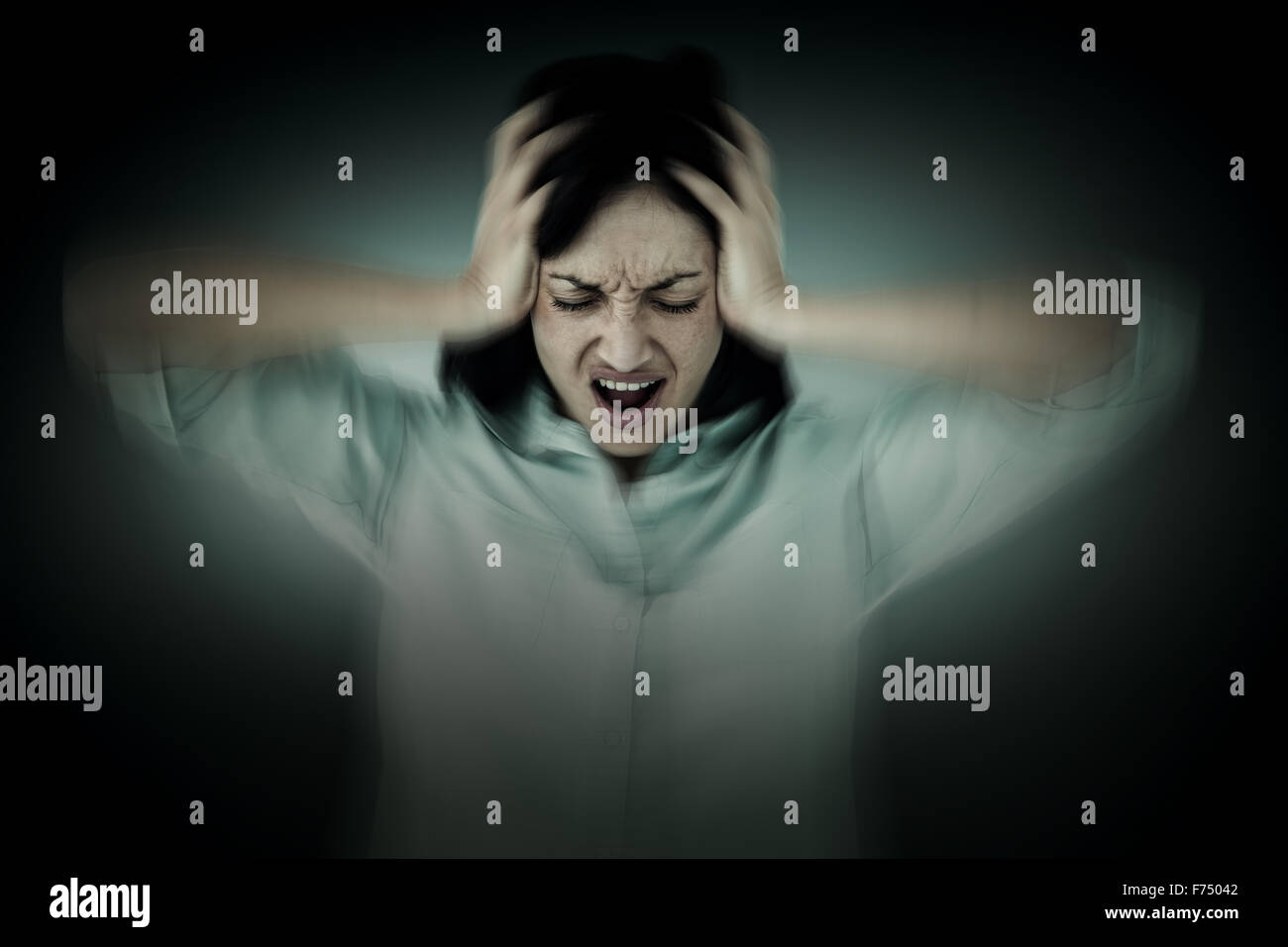 Composite image of depressed woman shouting Stock Photo