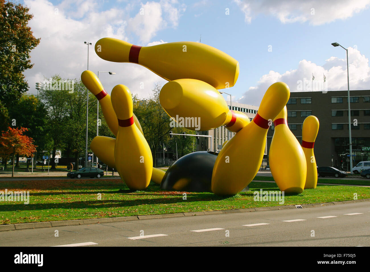 Bowling strike sculpture in a public park next to the road,  in the city of Eindhoven Stock Photo