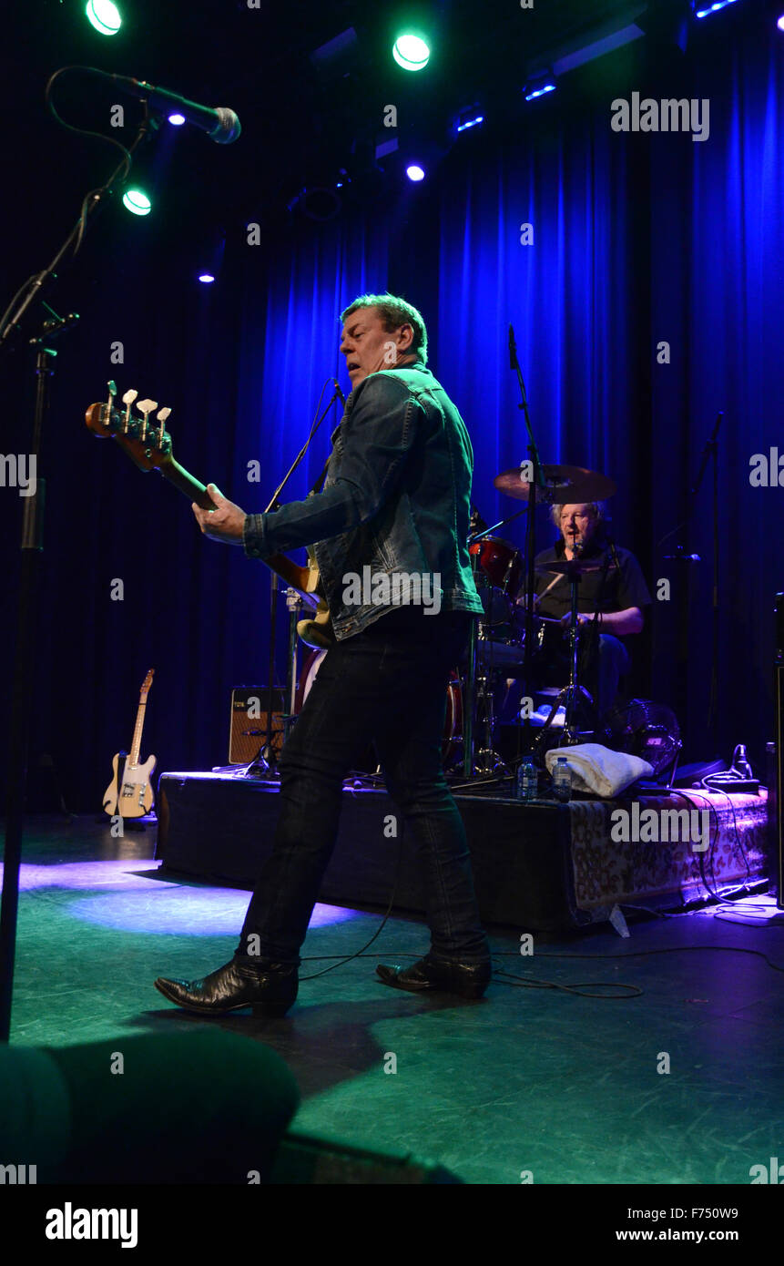 Gerry McAvoy of Band of Friends on stage playing his Fender Precision bass guitar Stock Photo