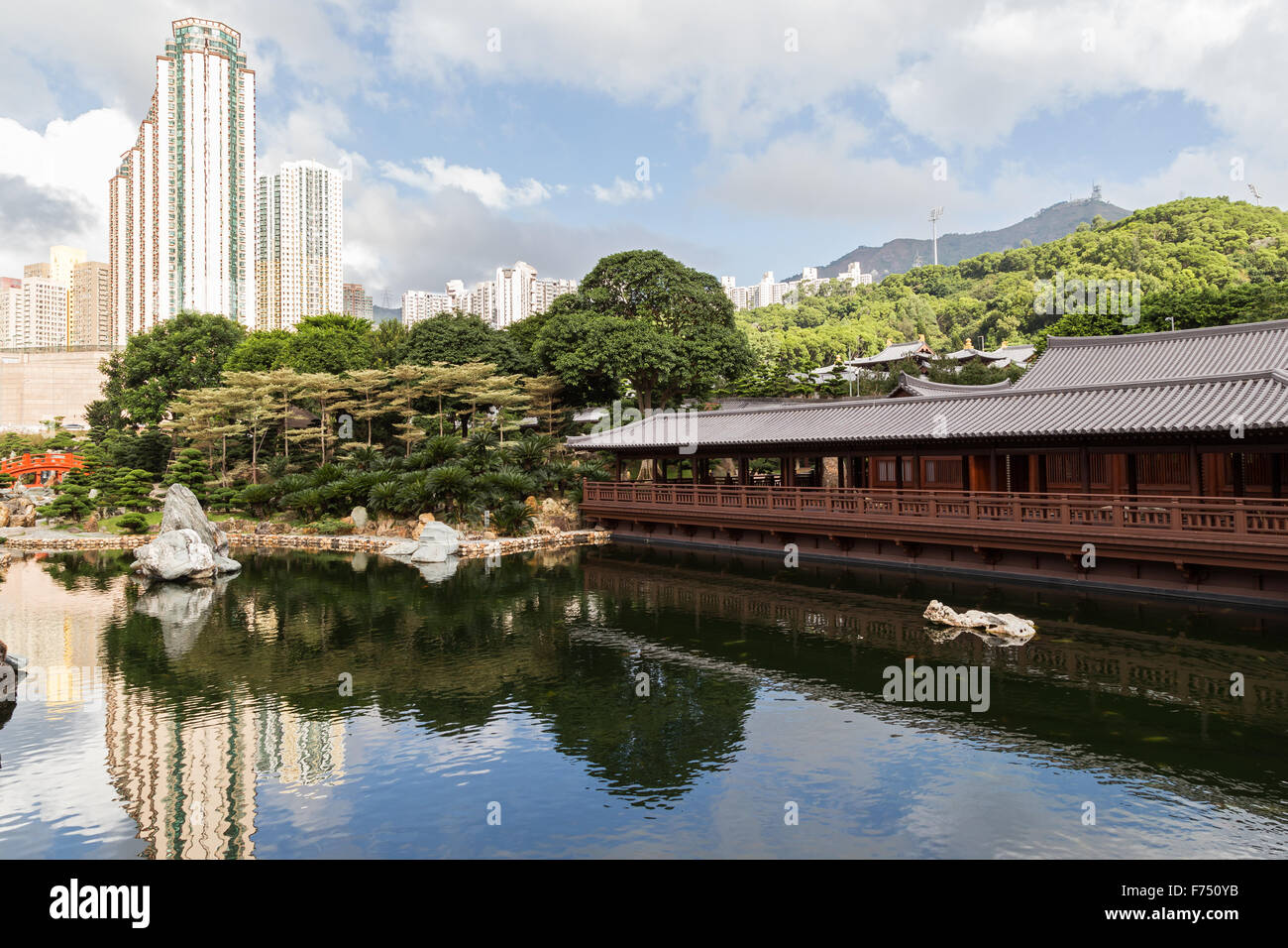 Pond and traditional wooden tea house at the Nan Lian Garden in Hong Kong, China. Stock Photo