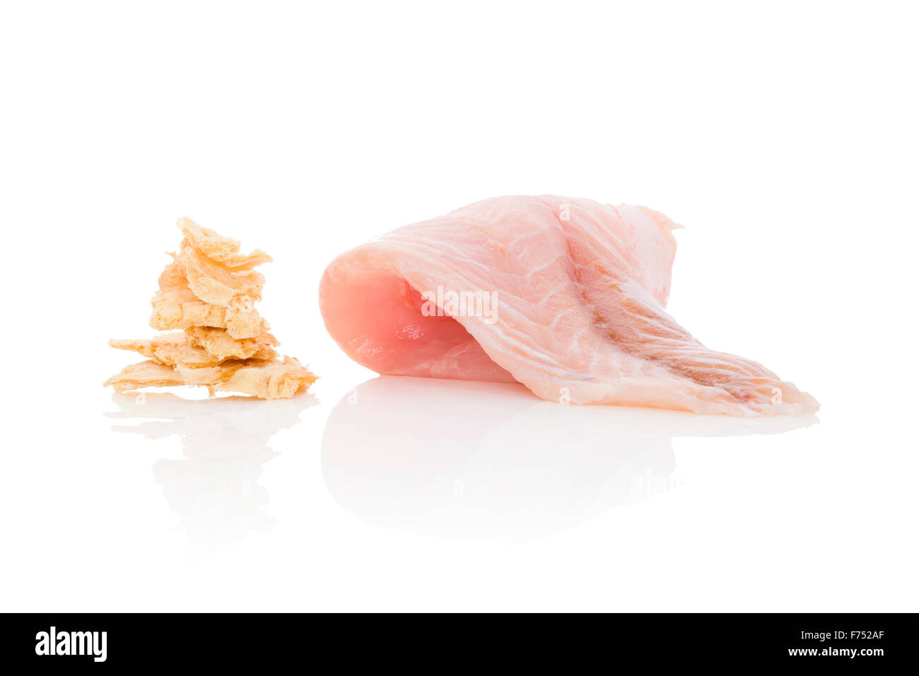 Fresh catfish fillet and dry fish chips isolated on white background. Culinary healthy seafood