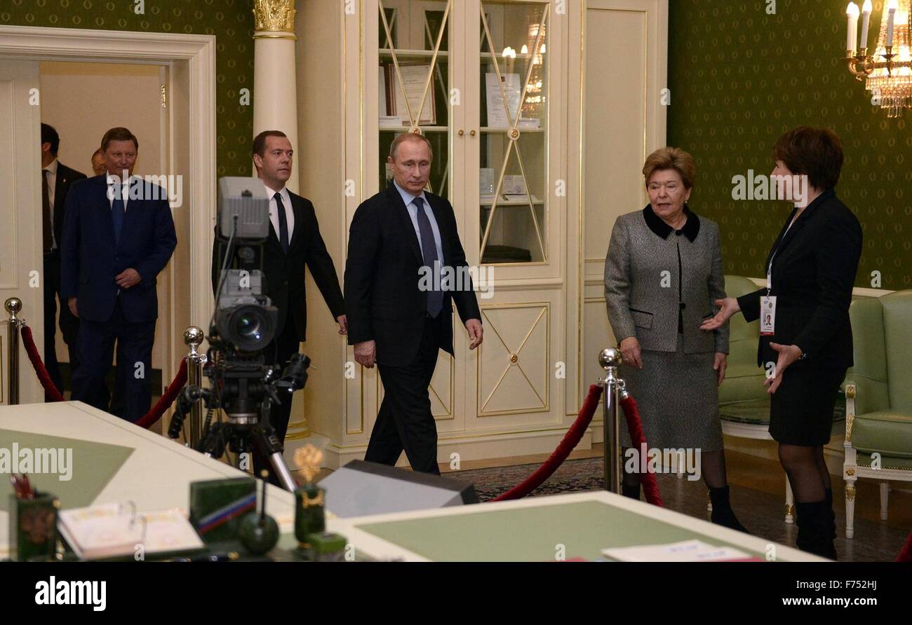 Yekaterinburg, Russia. 25th November, 2015. Tatyana Yumasheva, daughter of former president Boris Yeltsin and director of the Boris Yeltsin foundation gives a tour to Russian President Vladimir Putin, Prime Minister Dmitry Medvedev, left,  and her mother Naina Yeltsina, center right, at the Boris Yeltsin Museum November 25, 2015 in Yekaterinburg, Russia. The exhibition 'Seven Days That Changed Russia'  is about the transition from communism to democracy led by President Boris Yeltsin. Stock Photo