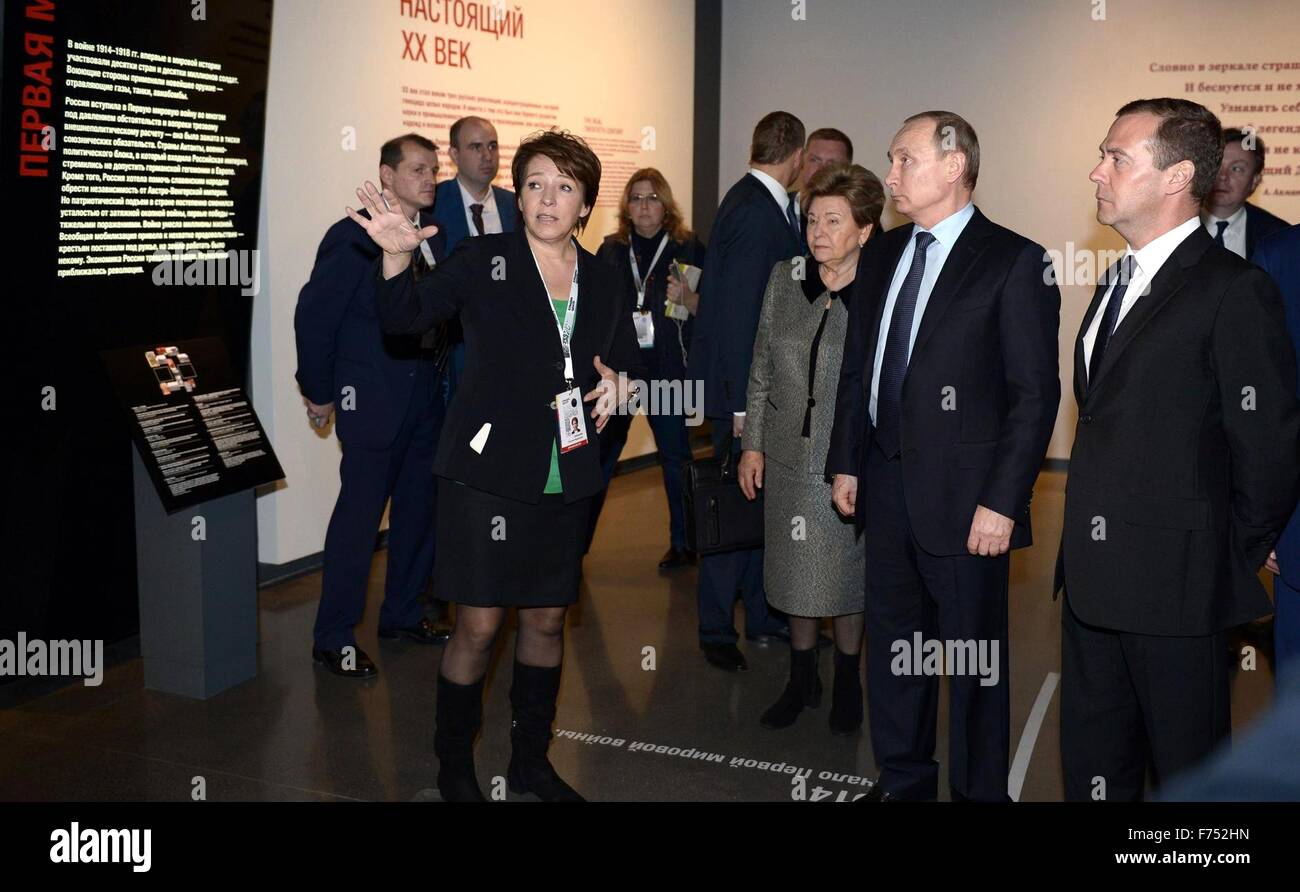 Yekaterinburg, Russia. 25th November, 2015. Tatyana Yumasheva, daughter of former president Boris Yeltsin and director of the Boris Yeltsin foundation gives a tour to Russian President Vladimir Putin, Prime Minister Dmitry Medvedev, right,  and Naina Yeltsina, center, at the Boris Yeltsin Museum November 25, 2015 in Yekaterinburg, Russia. The exhibition 'Seven Days That Changed Russia'  is about the transition from communism to democracy led by President Boris Yeltsin. Stock Photo