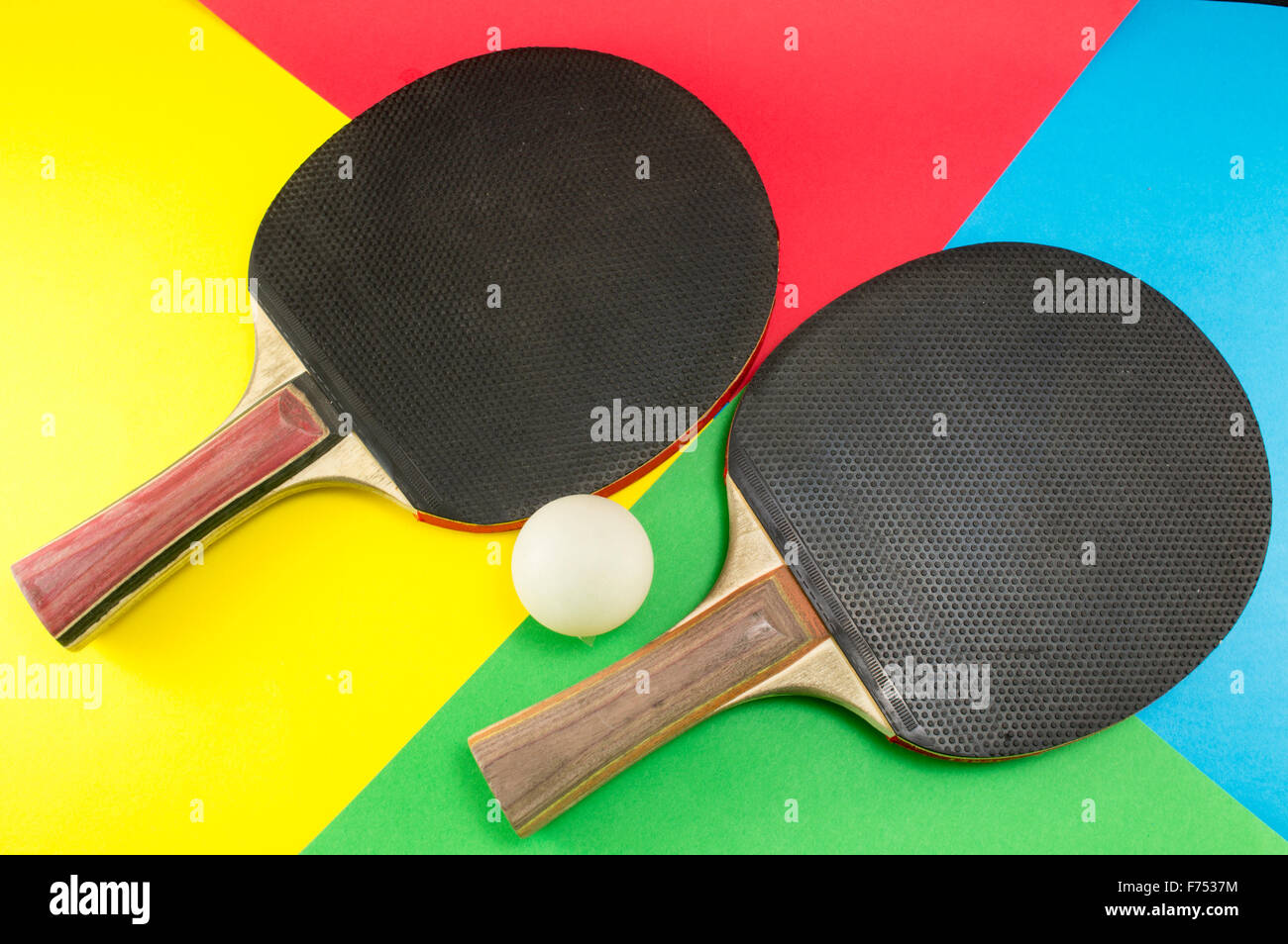 Pair of table tennis paddles on a colorful collage background Stock Photo