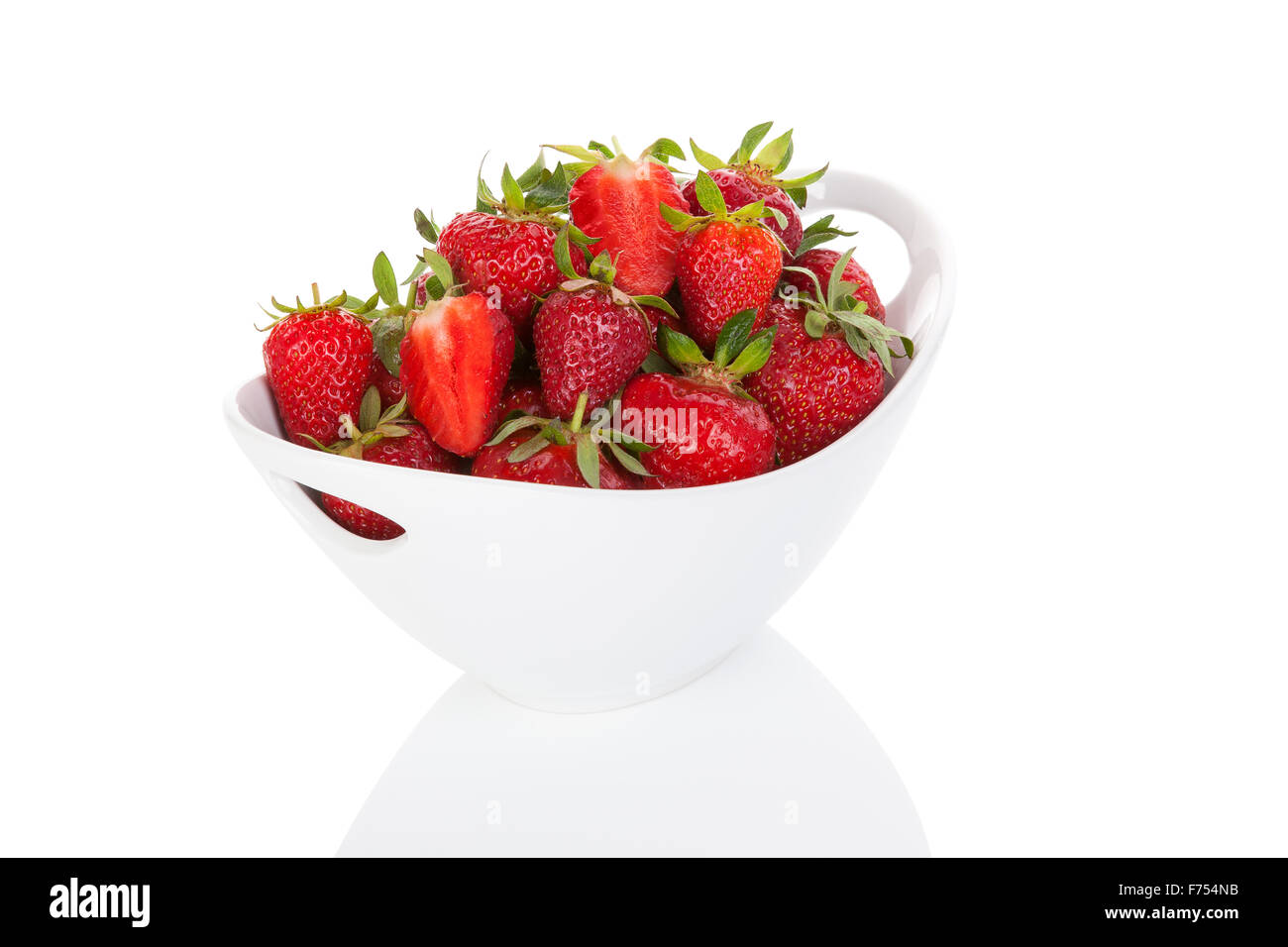 Delicious ripe strawberries in white bowl isolated on white background ...