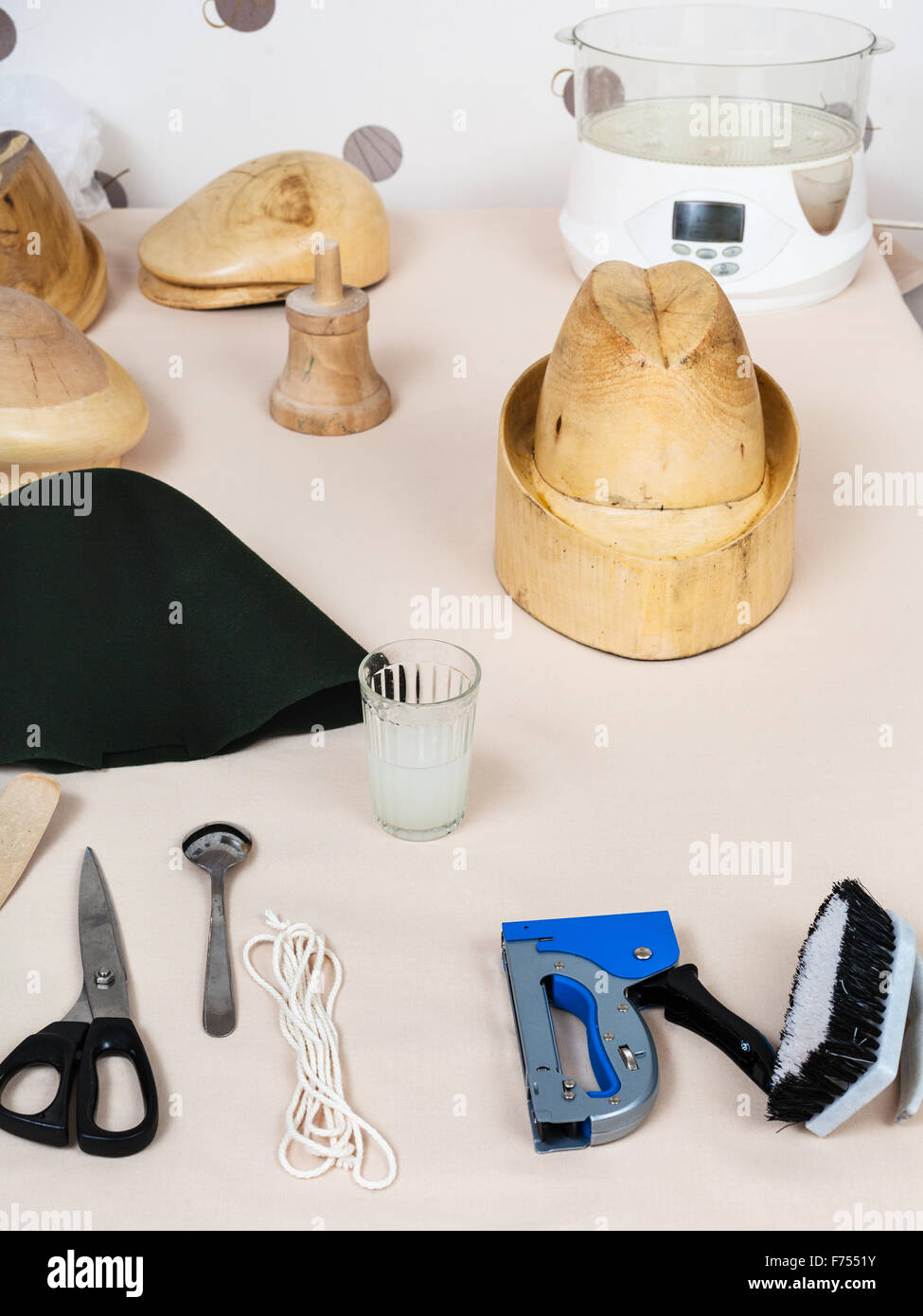 workshop for alpine felt hat making - tools and equipment for hatmaking on  table Stock Photo - Alamy