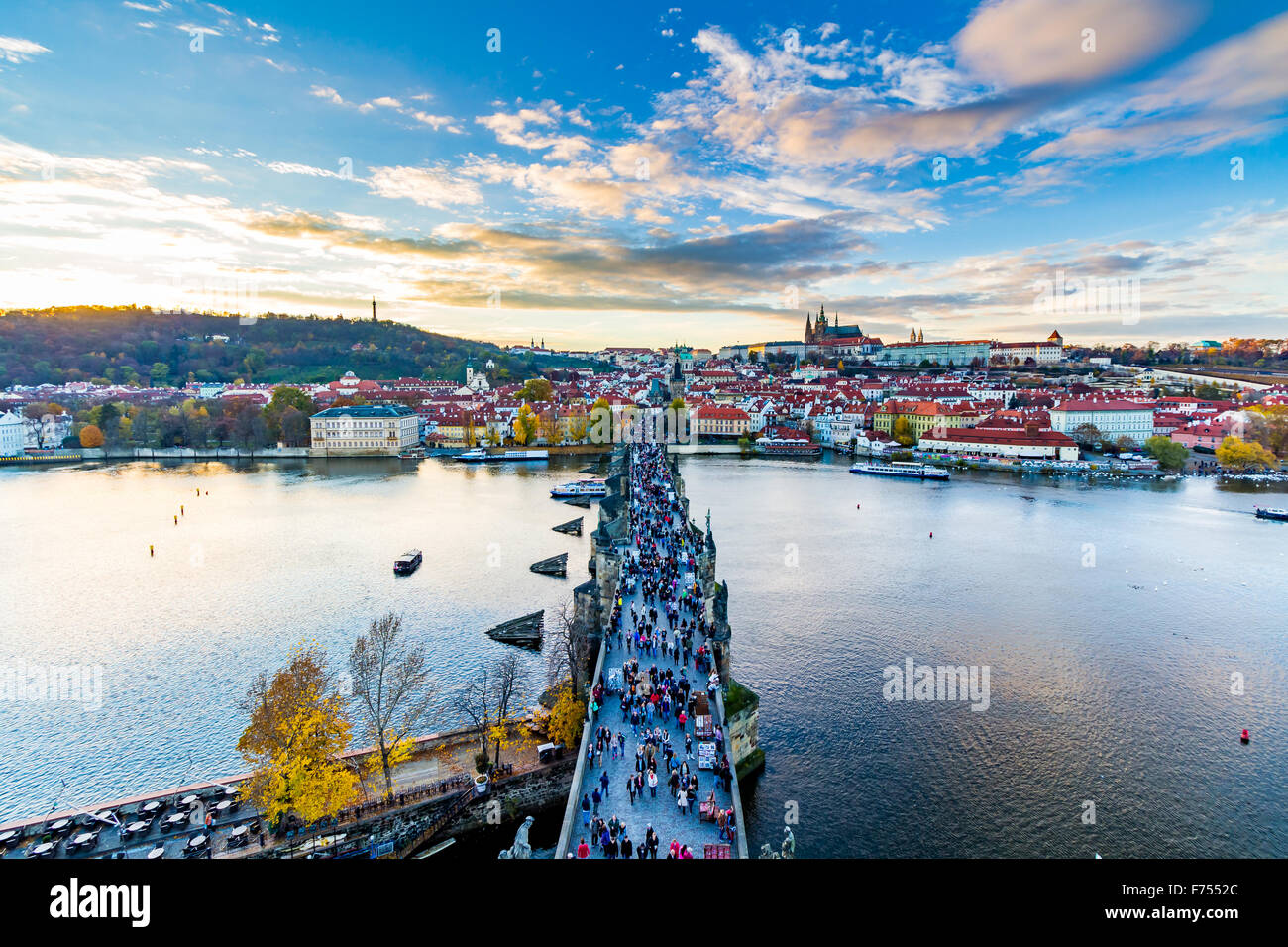 Scenic summer evening panorama of the Old Town architecture with Vltava river, Charles Bridge and St.Vitus Cathedral in Prague, Stock Photo