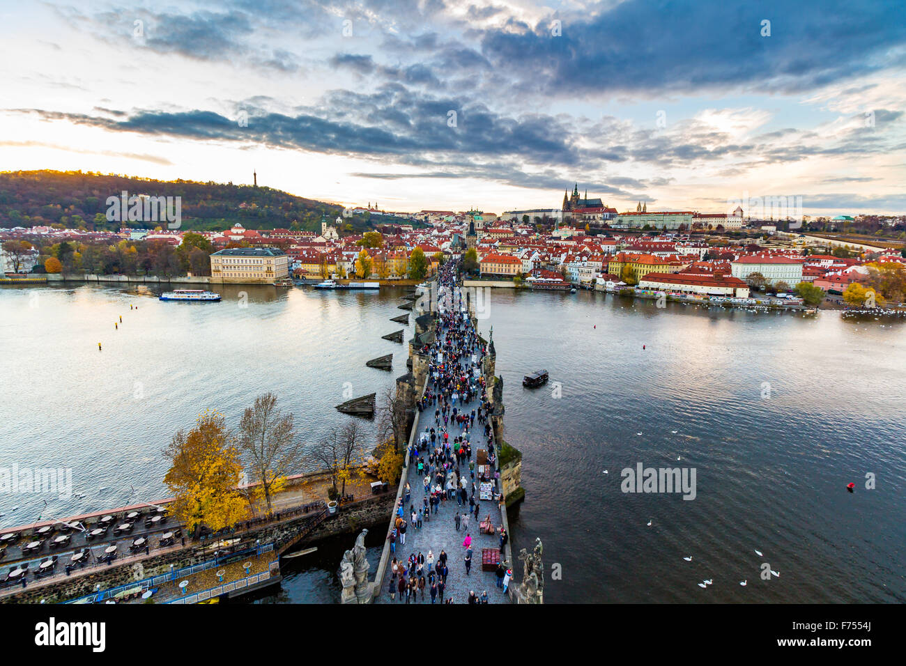 Scenic summer evening panorama of the Old Town architecture with Vltava river, Charles Bridge and St.Vitus Cathedral in Prague, Stock Photo