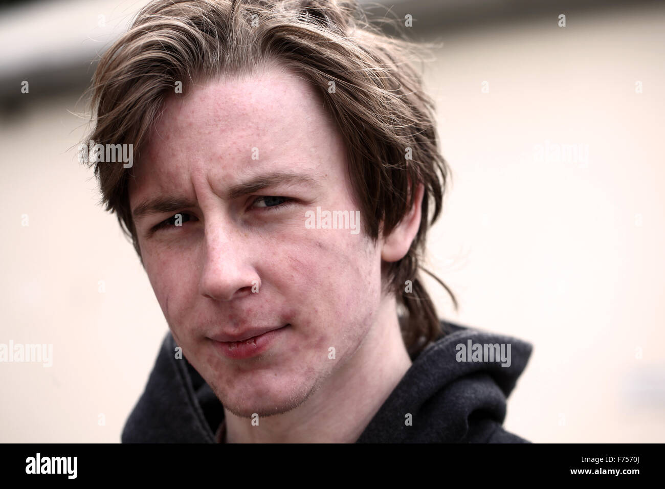 weather beaten face of a young man in his late teens or early twenties. Stock Photo