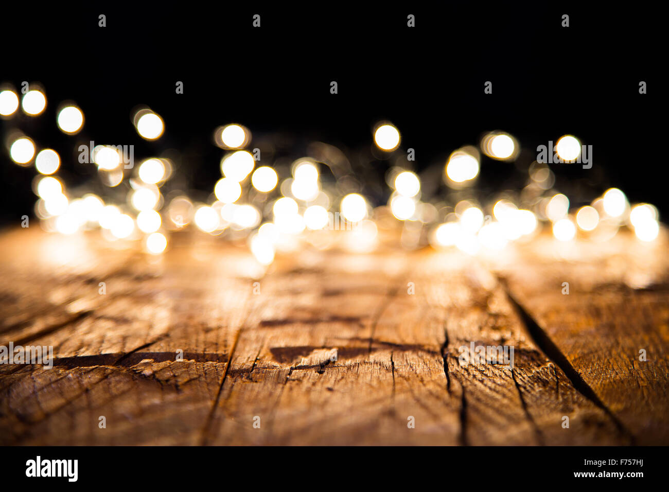 Blur christmas lights on wooden planks Stock Photo - Alamy