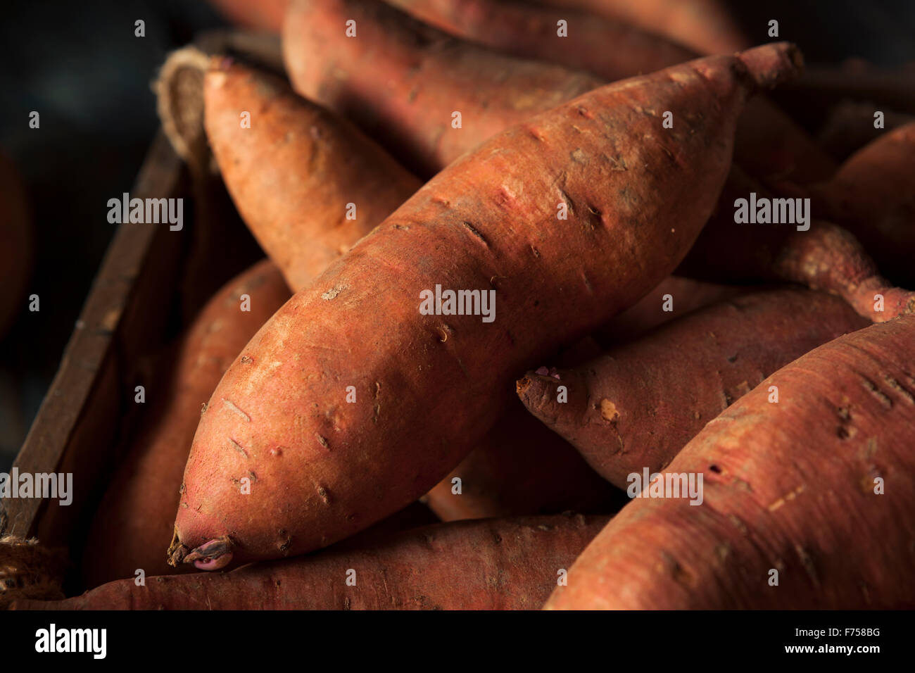 Raw Organic Sweet Potatoes in a Box Stock Photo