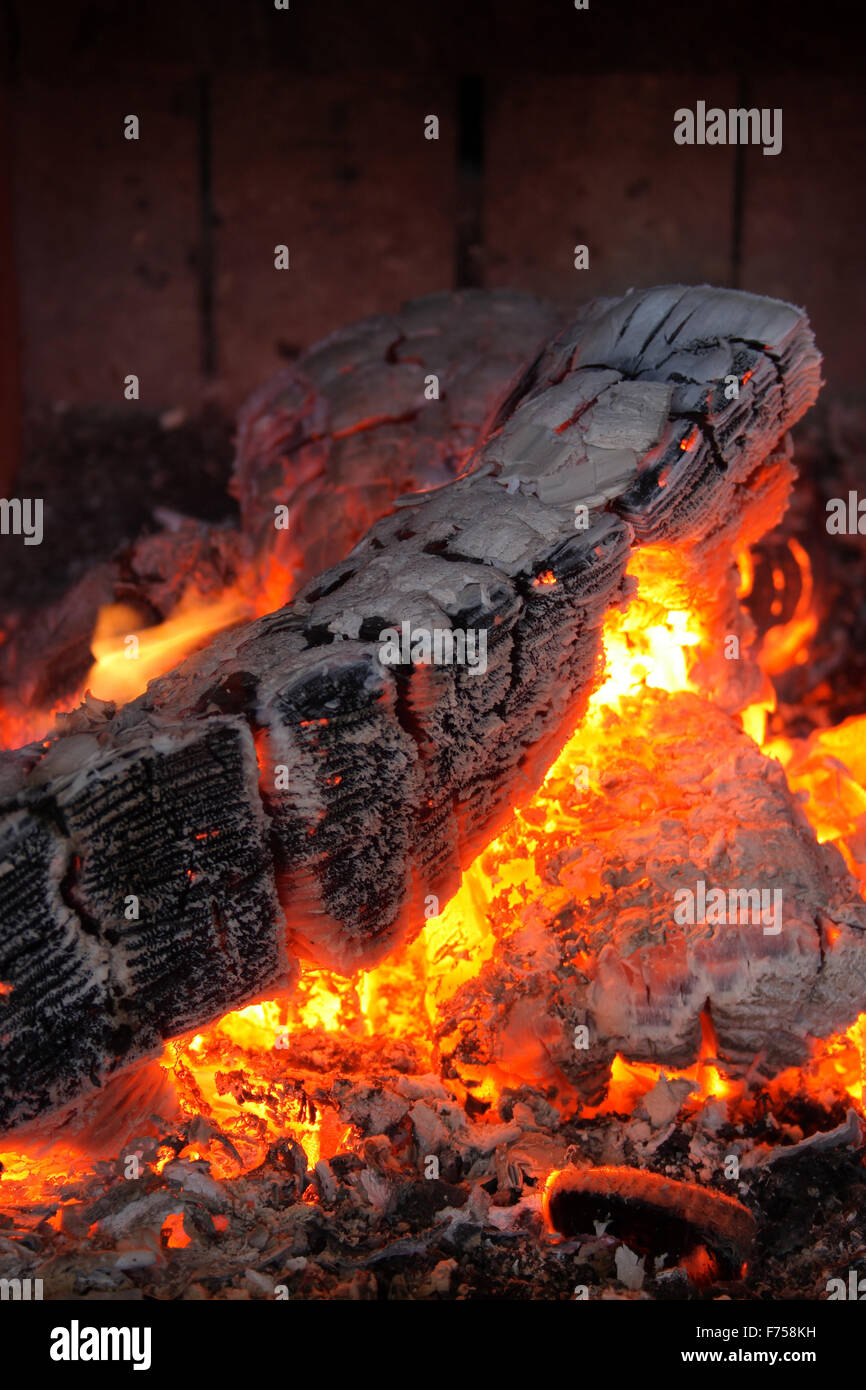 Burning and glowing pieces of wood in Fireplace Stock Photo - Alamy