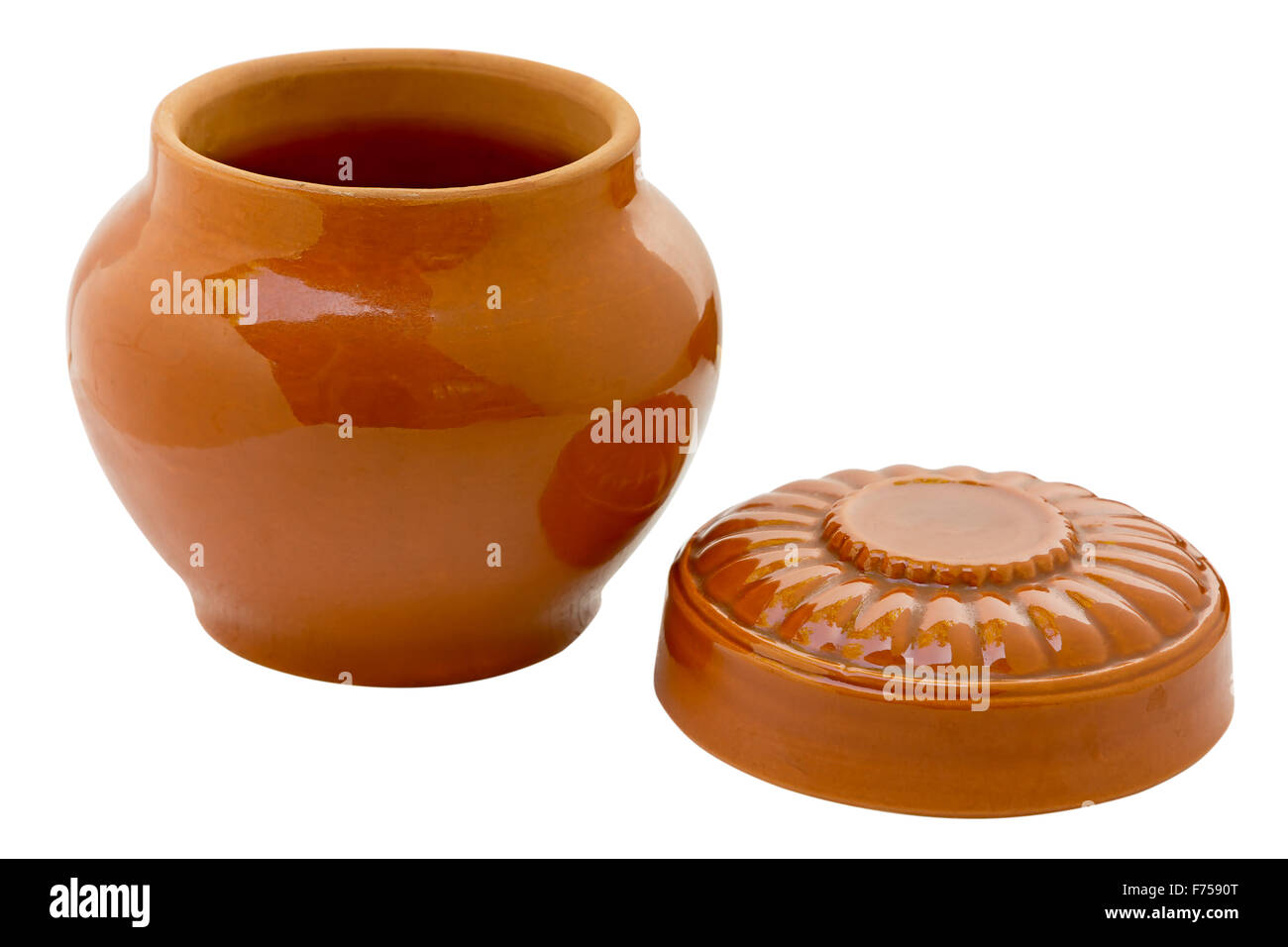 Ceramic pot roast with the cover open. Isolated on white background. Clipping path is saved. Stock Photo