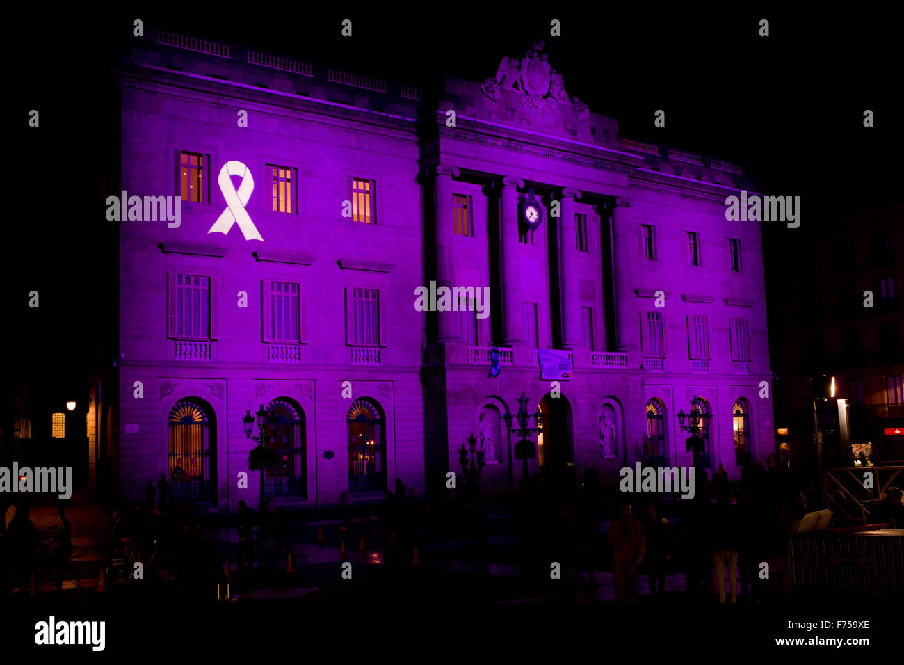 Barcelona, Spain. 25th November, 2015.  The Barcelona City Hall facade is lit in violet color in memory of all victims of male violence during the International Day for the Elimination of Violence against Women. In Spain forty-eight women were killed by male violence in 2015. Credit:   Jordi Boixareu/Alamy Live News Stock Photo