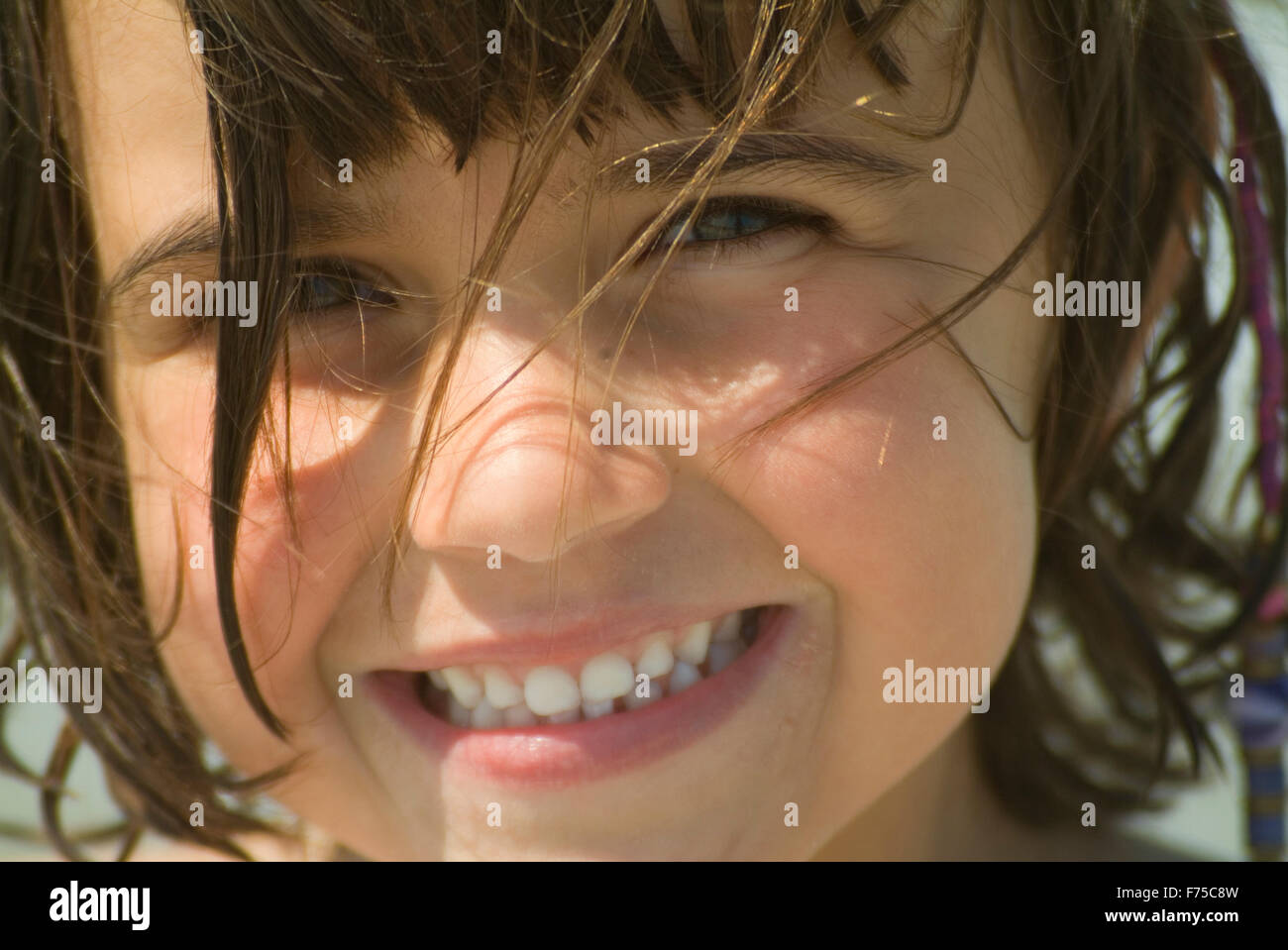 young girl smiling at the camera Stock Photo - Alamy